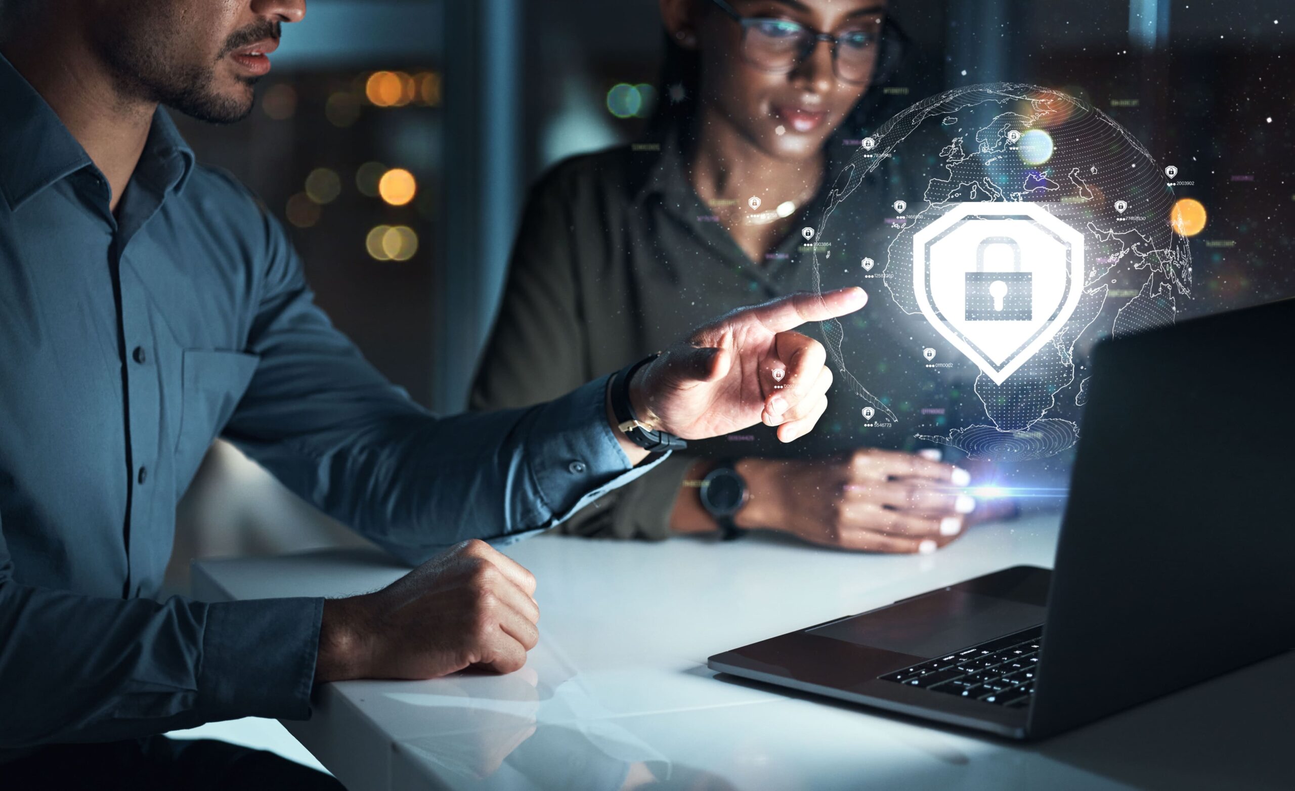 "Cybersecurity Training for VAs" - Man teaching a woman cybersecurity protocols while pointing at a hologram