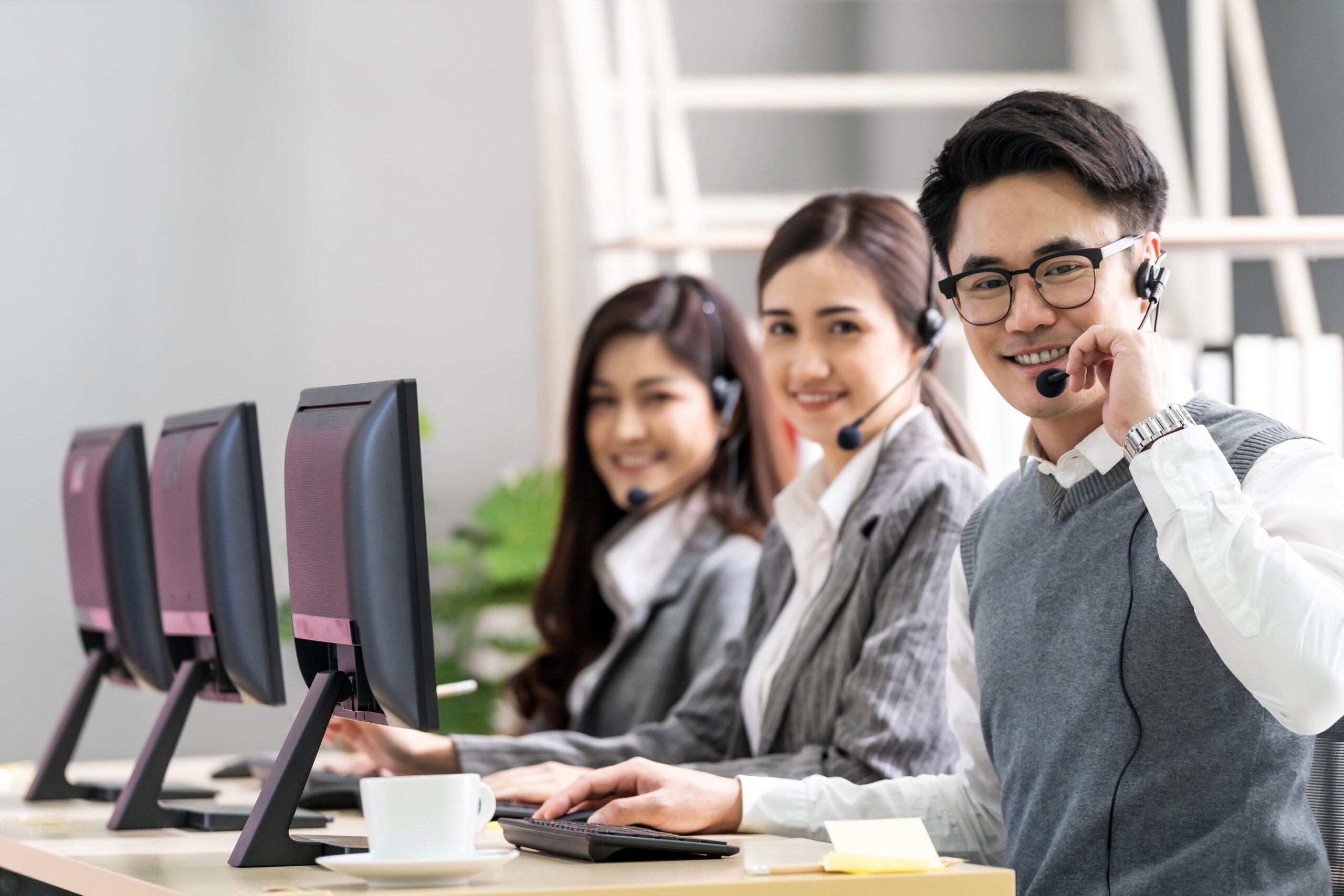 Top 7 VA Companies in the Philippines - Three virtual assistants on their computers